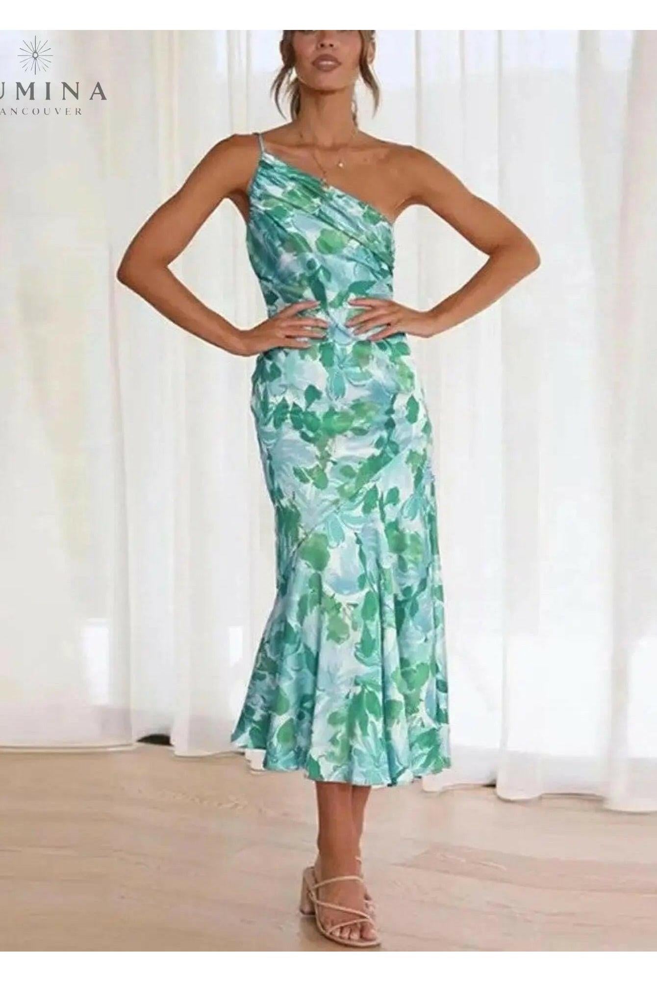 Lumina Wear Tiphaine floral pattern dress in orange with a flowing silhouette and vibrant flower print.
