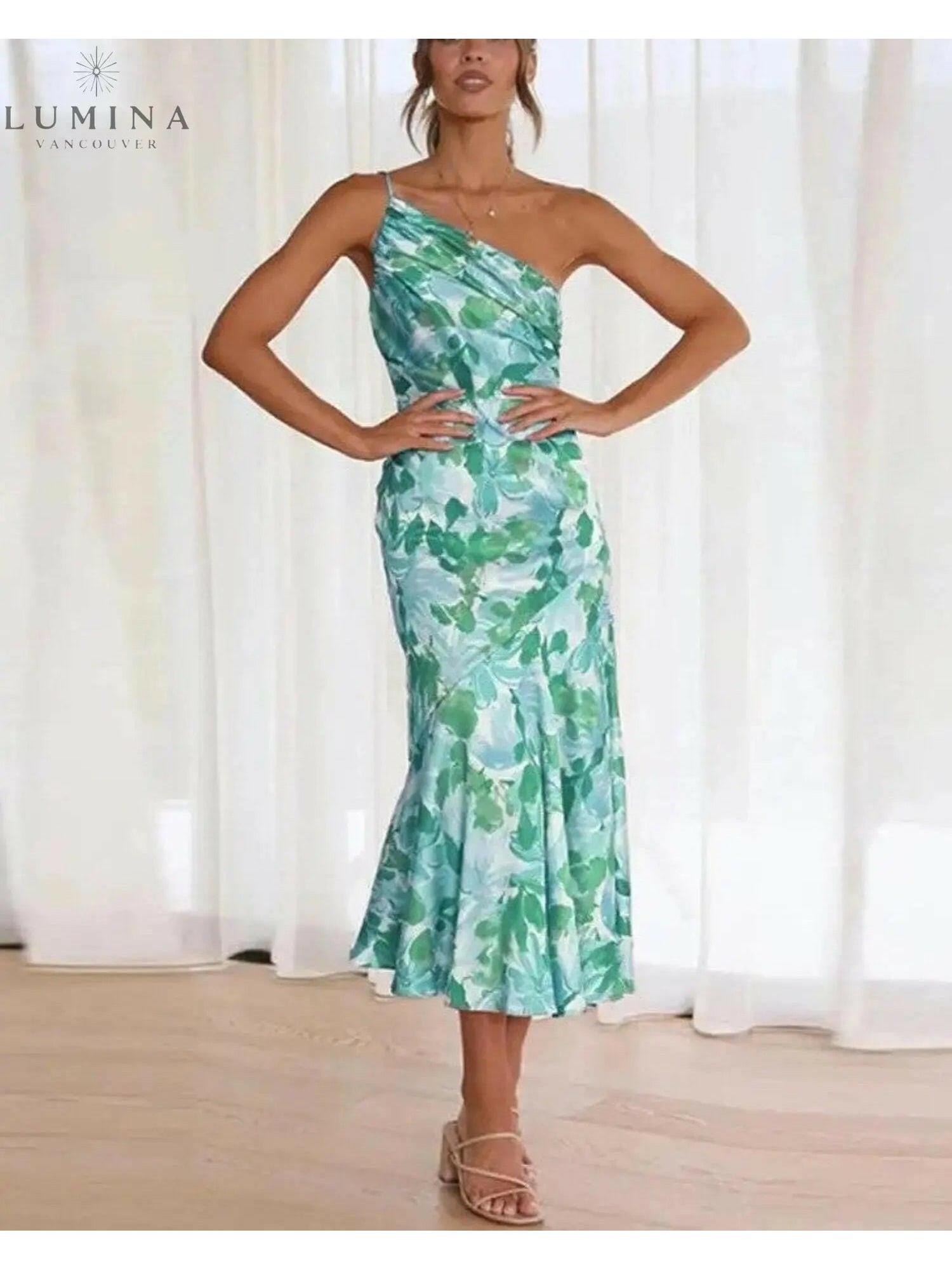Orange floral-patterned dress by Lumina Vancouver featuring a stylish, feminine design with vibrant flower details.