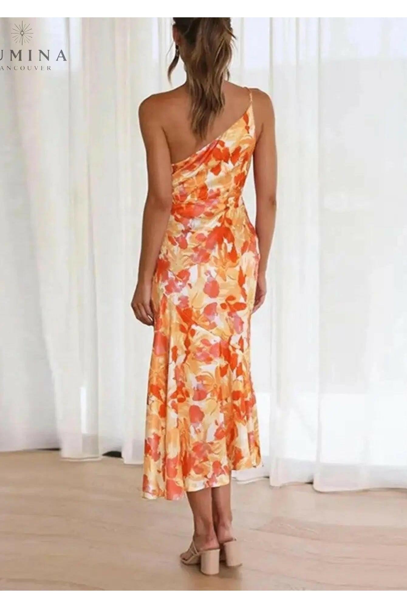 Lumina Wear Tiphaine floral dress in orange with a vibrant floral pattern, featuring a stylish and comfortable design.