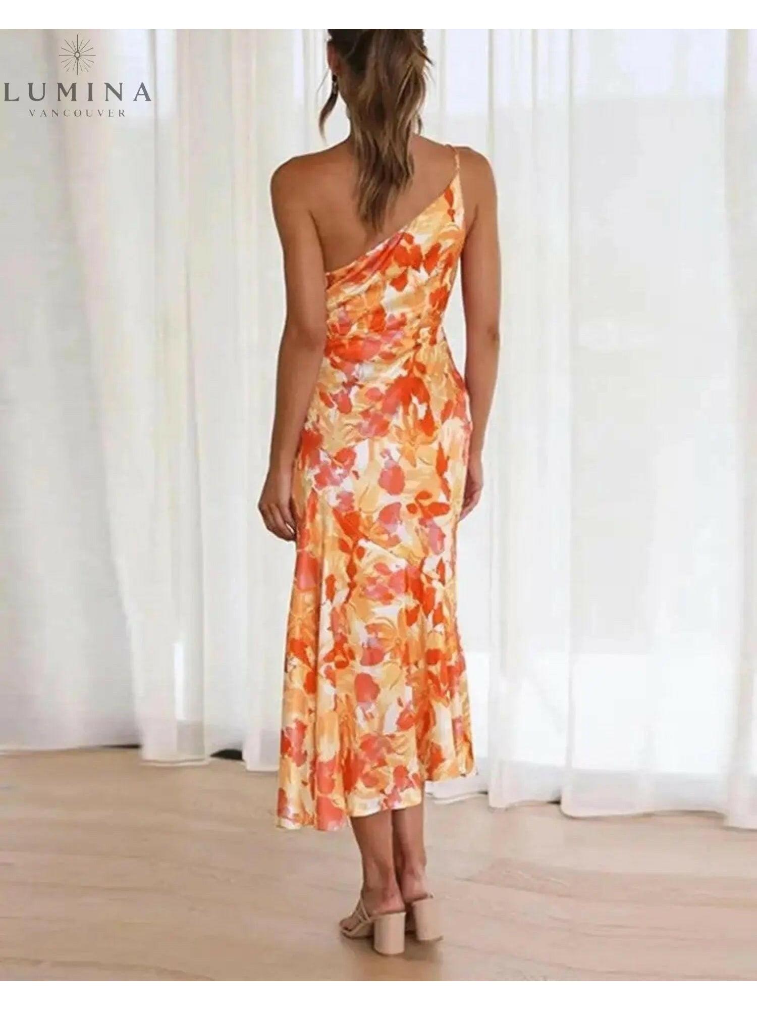 Orange floral pattern dress by Lumina Vancouver featuring a stylish design and short sleeves.