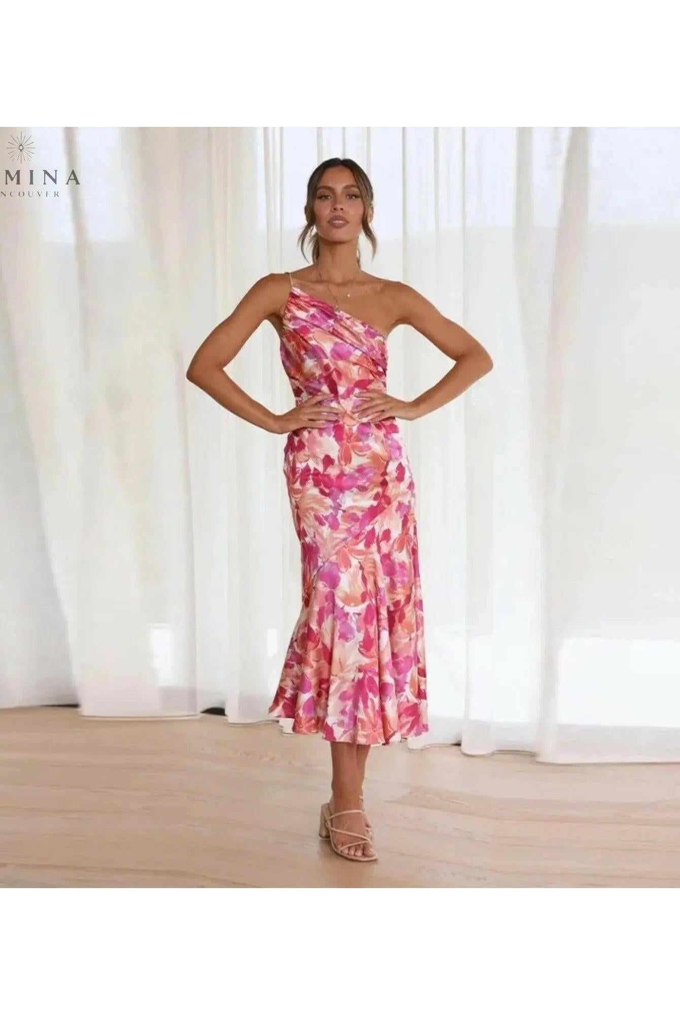Lumina Wear Tiphaine dress with orange floral pattern, short sleeves, and lightweight fabric, perfect for casual or summer wear.