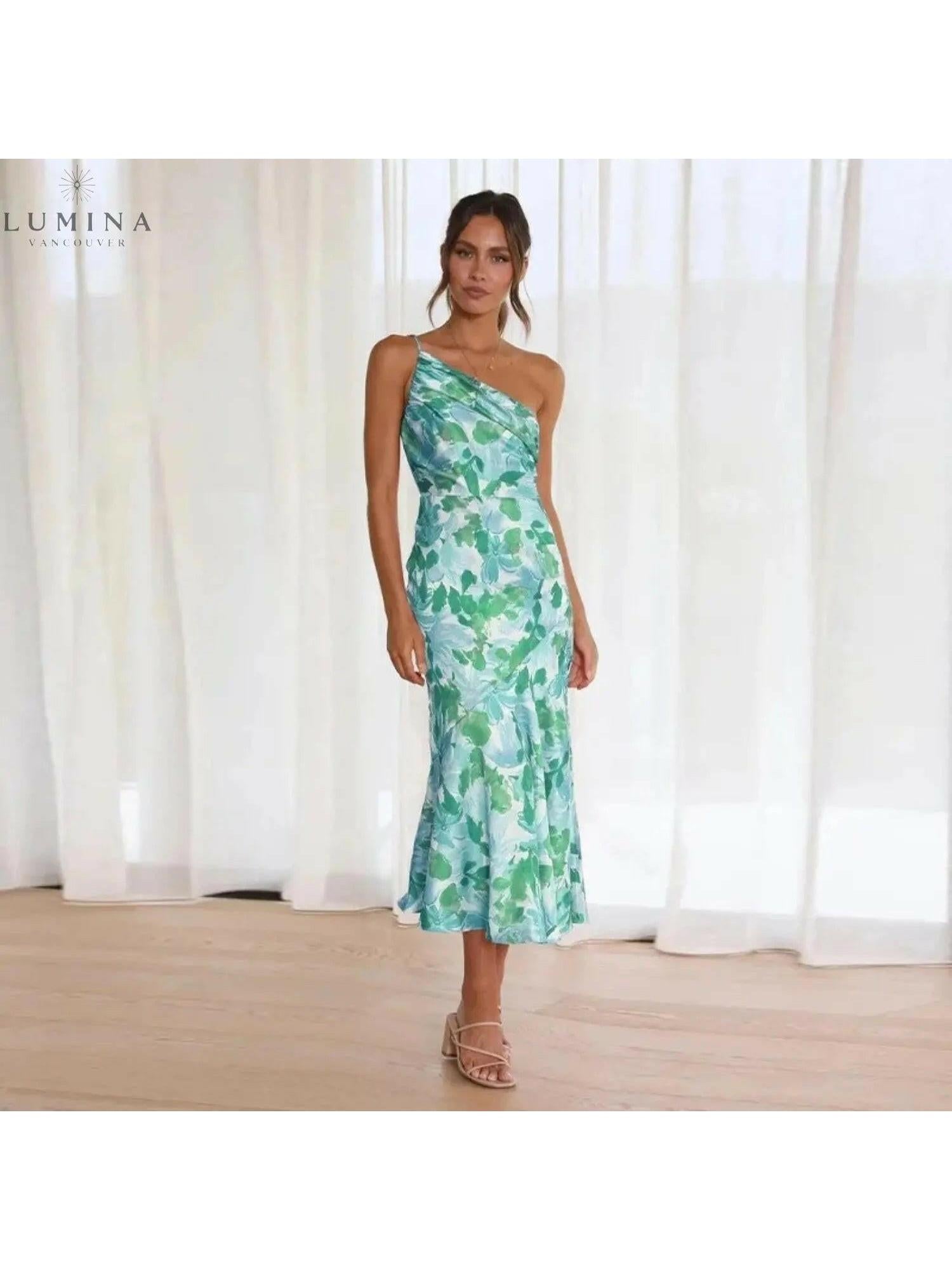 Orange floral patterned dress by Lumina Vancouver, featuring a stylish design with vibrant flower prints.