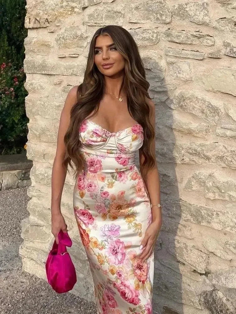 Lucy floral satin maxi dress by Lumina Vancouver, featuring a flowing silhouette and vibrant floral pattern.