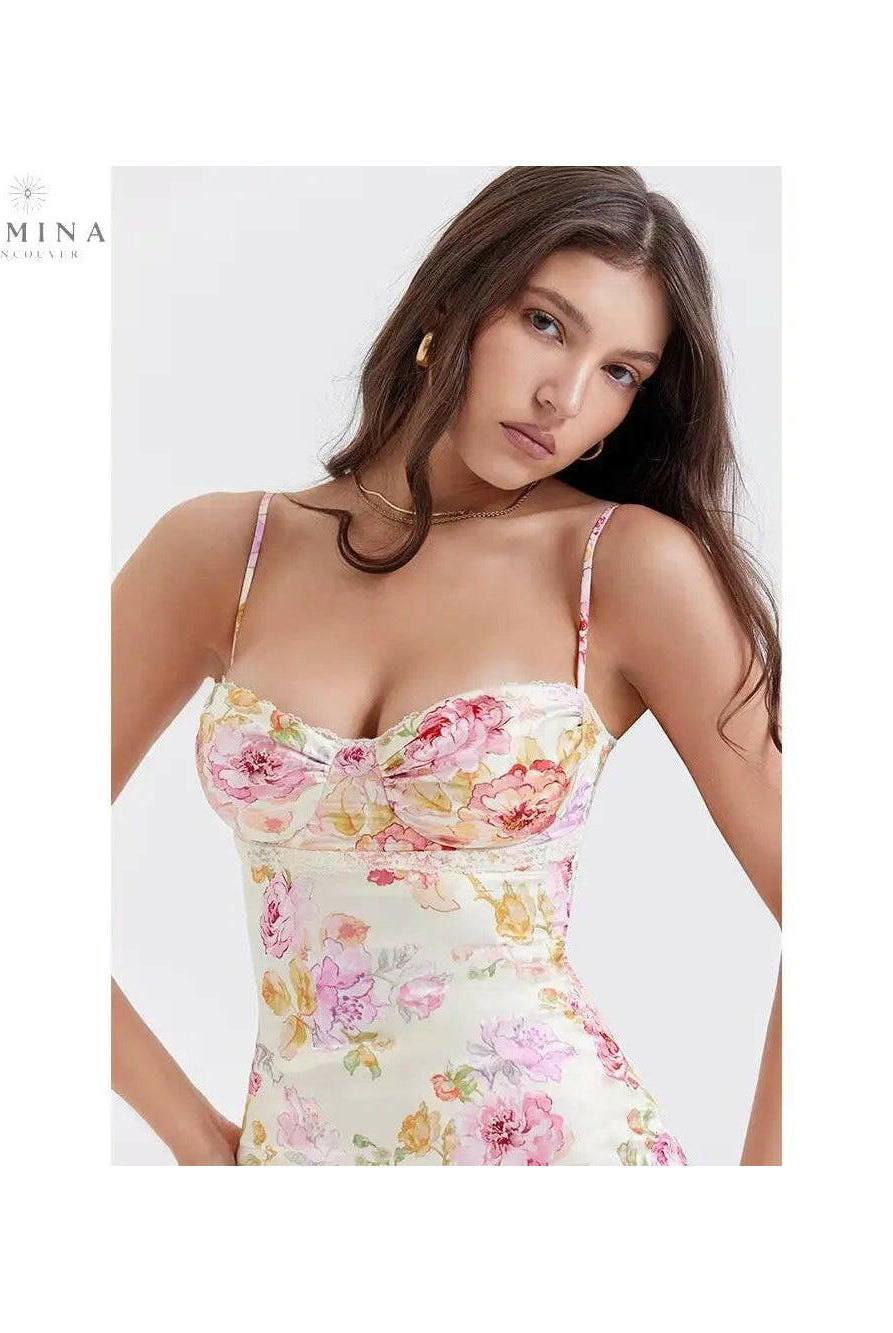 Lumina Wear Lucy floral satin maxi dress in soft pastel colors, featuring a flowing design and elegant floral print.