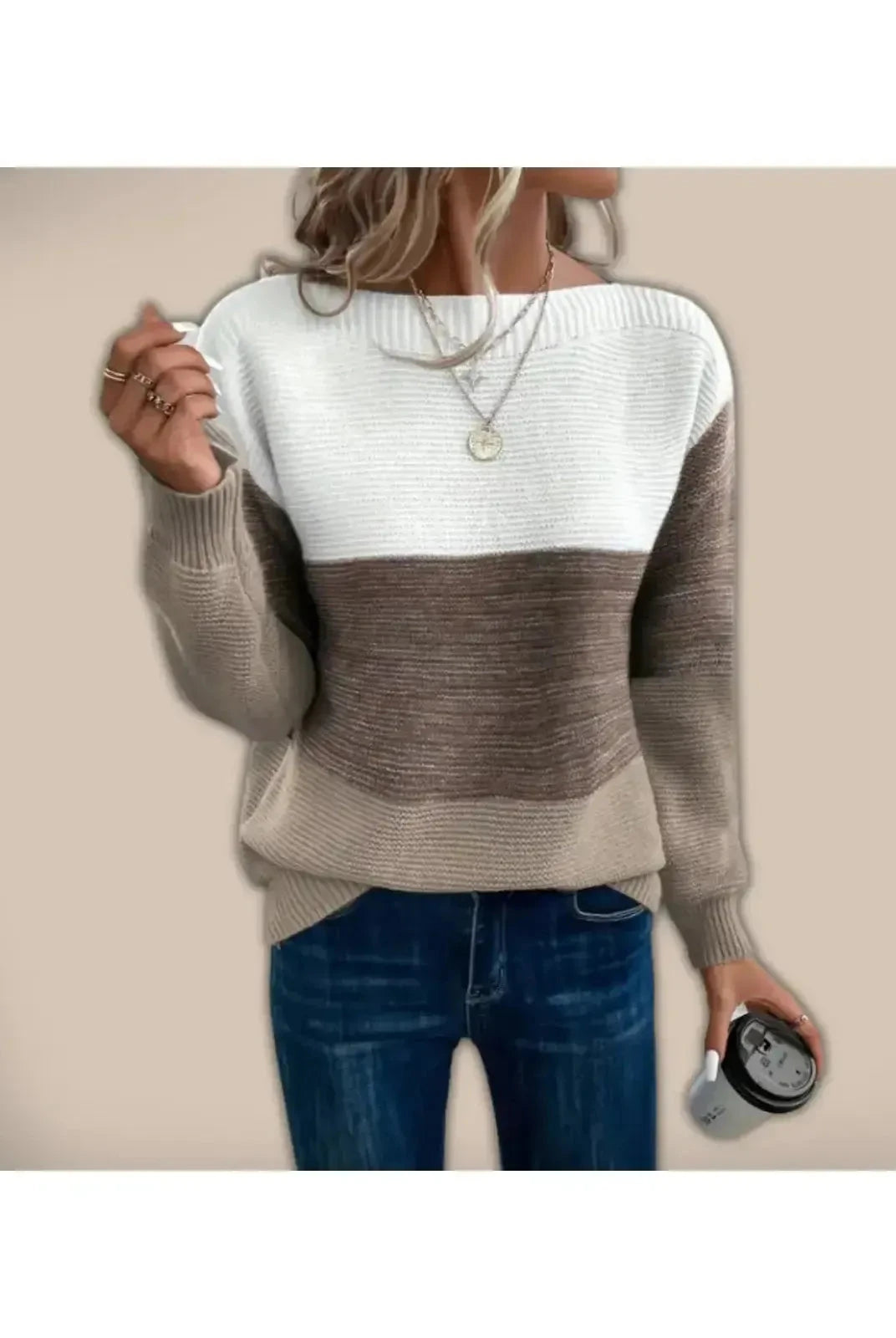 Beige Lumina Wear Alice sweater displayed on a hanger, showcasing its cozy knit and classic style.