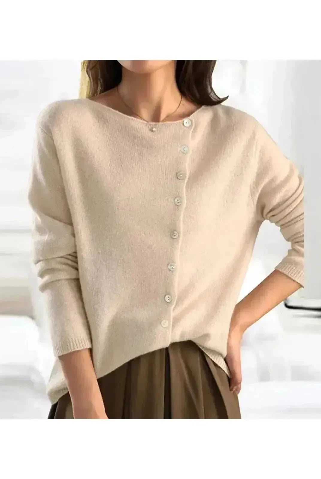Light grey Malu knitted sweater by Lumina Wear, featuring soft knit fabric and a cozy fit, displayed on a white background.