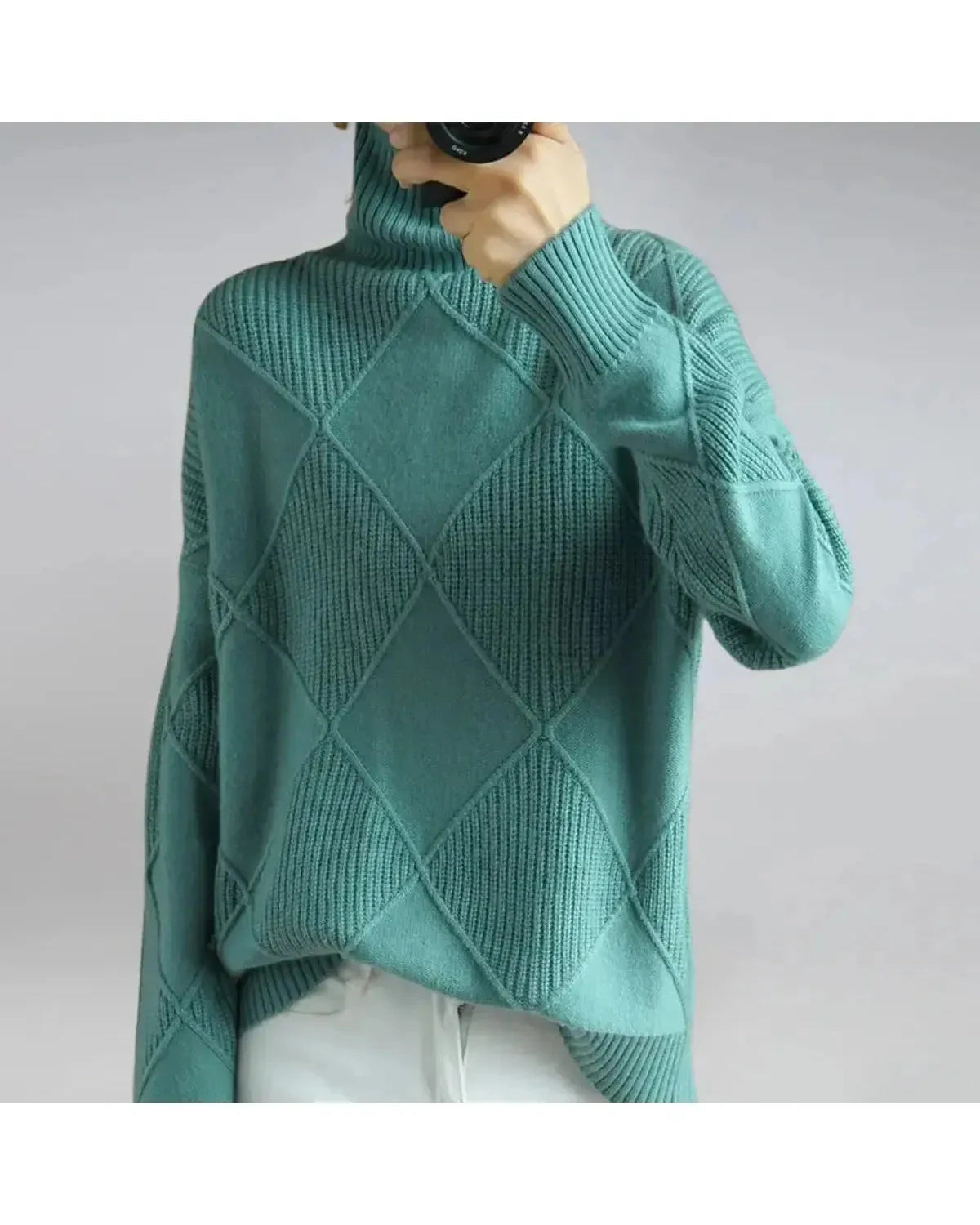 Lumina Wear Nora turtleneck sweater in khaki, showcasing its cozy fit and ribbed collar on a neutral background.
