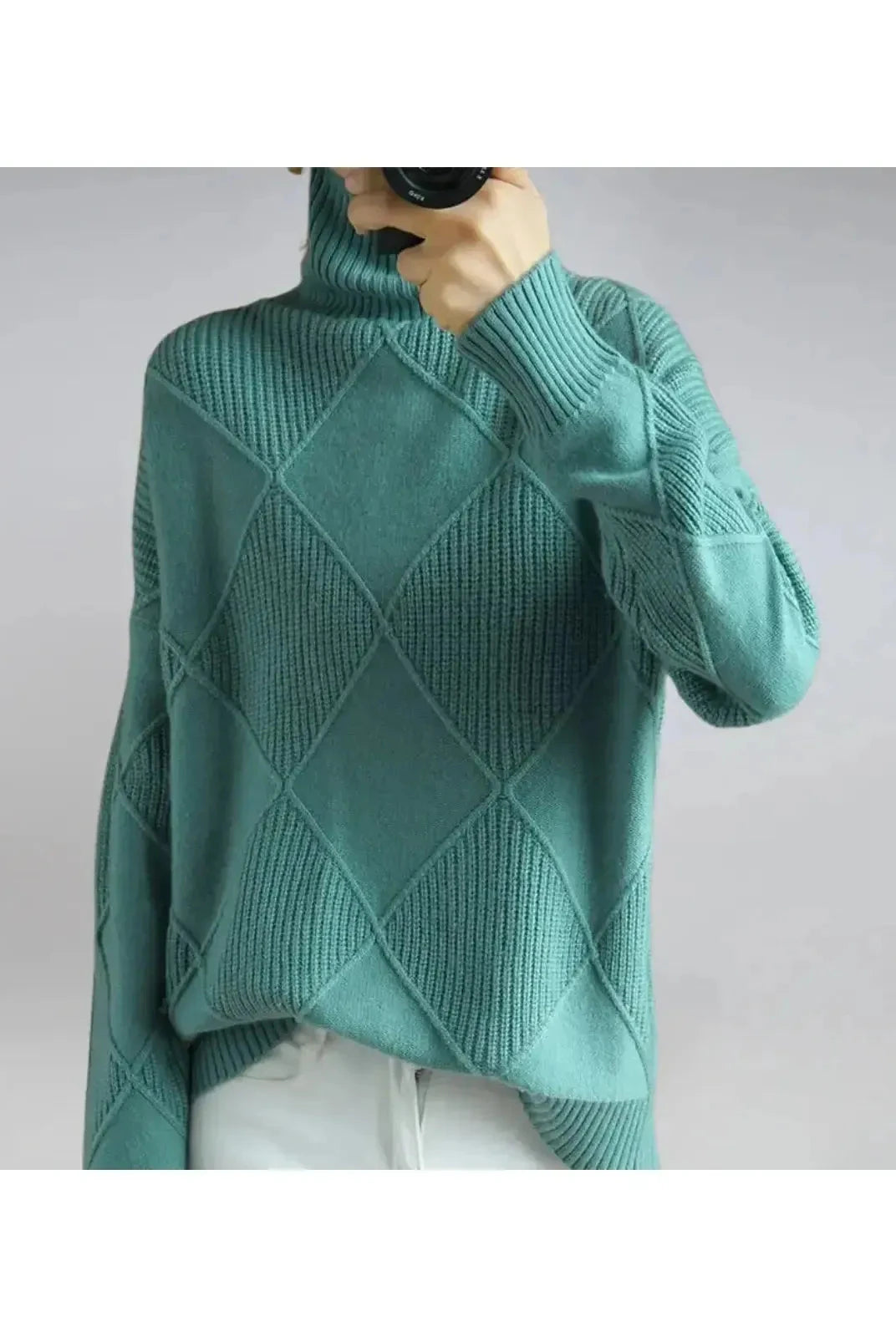 Lumina Wear Nora turtleneck sweater in khaki, showcasing its cozy fit and ribbed collar on a neutral background.