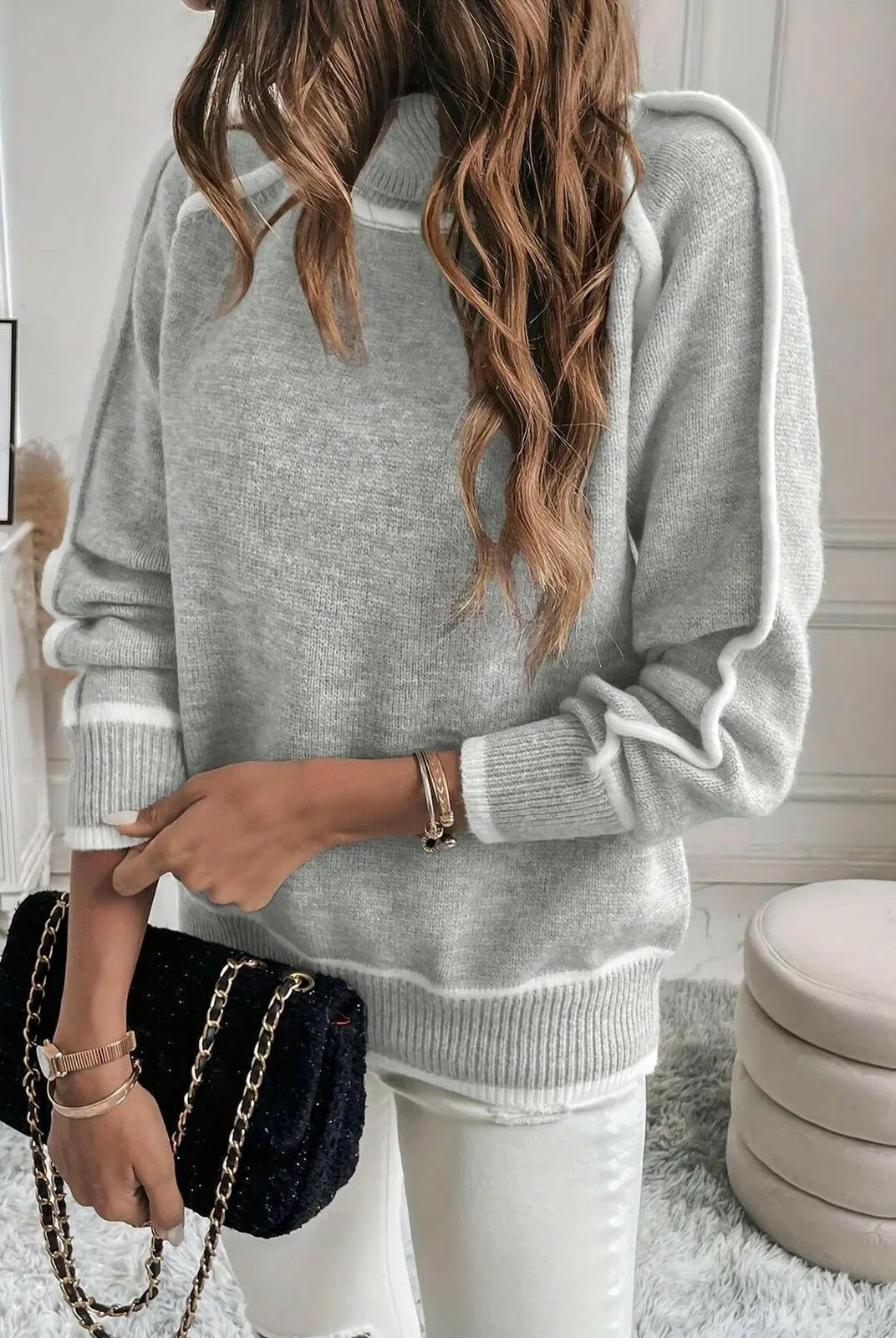 Lumina Wear Maura Turtleneck Sweater in cozy knit fabric, shown in a close-up of the dark-colored turtleneck and textured material.