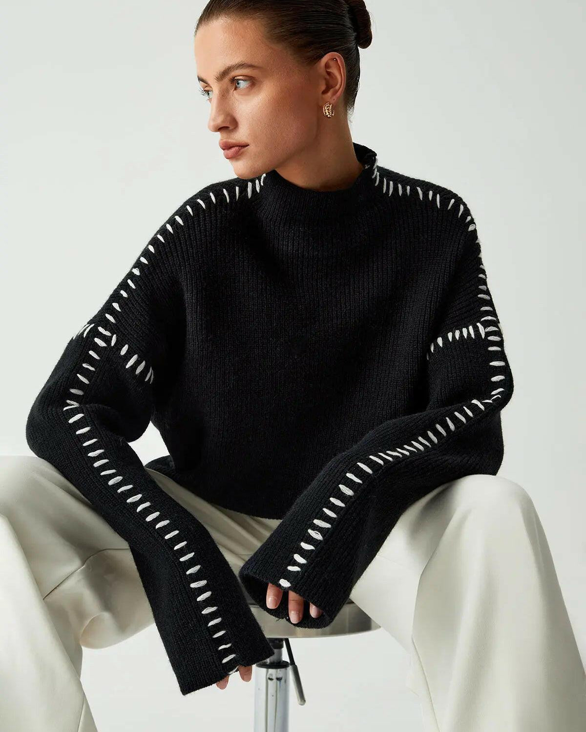 Lumina Wear Riley knitted sweater featuring a cozy, textured knit in neutral tones, perfect for casual winter wear.