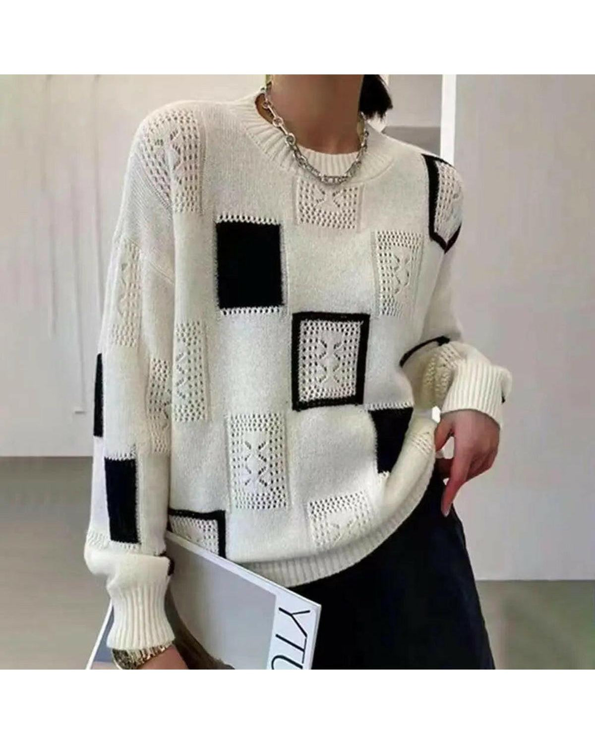 Lumina Wear Rema Geometric Pullover sweater in white, featuring a modern geometric design, displayed on a mannequin.