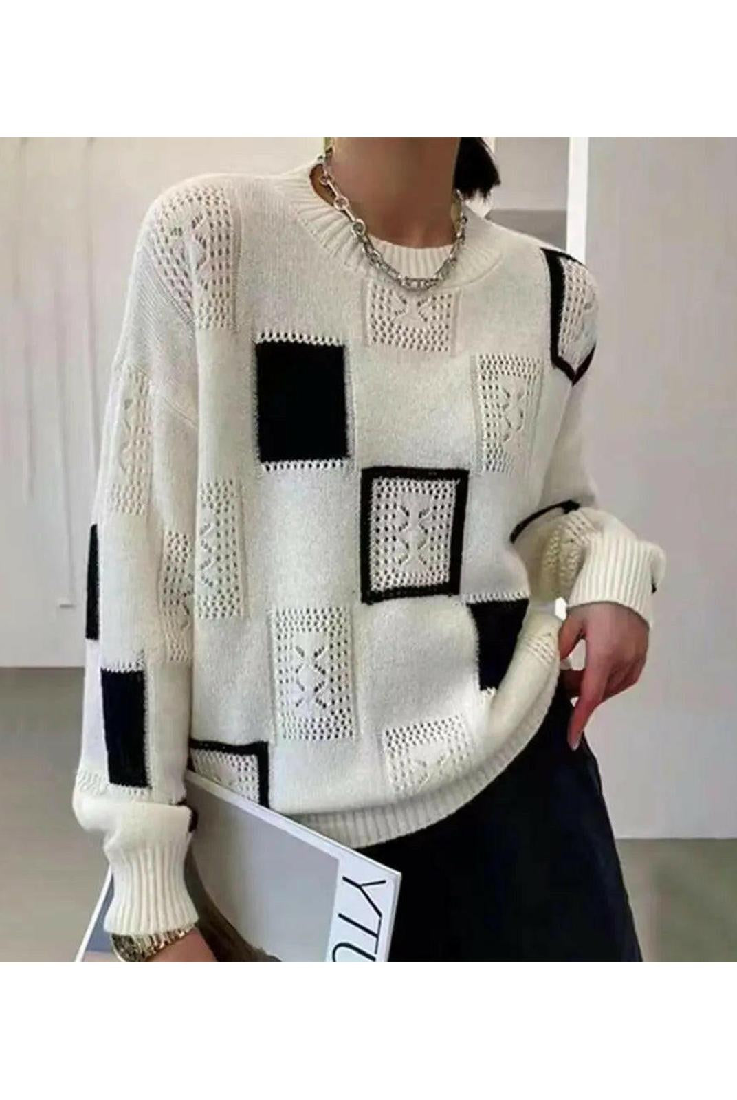 Lumina Wear Rema Geometric Pullover sweater in white, featuring a modern geometric design, displayed on a mannequin.