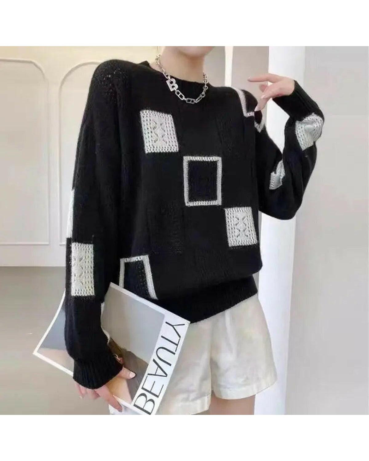 White Lumina Wear Rema Geometric Pullover sweater with a modern geometric pattern, displayed on a mannequin.