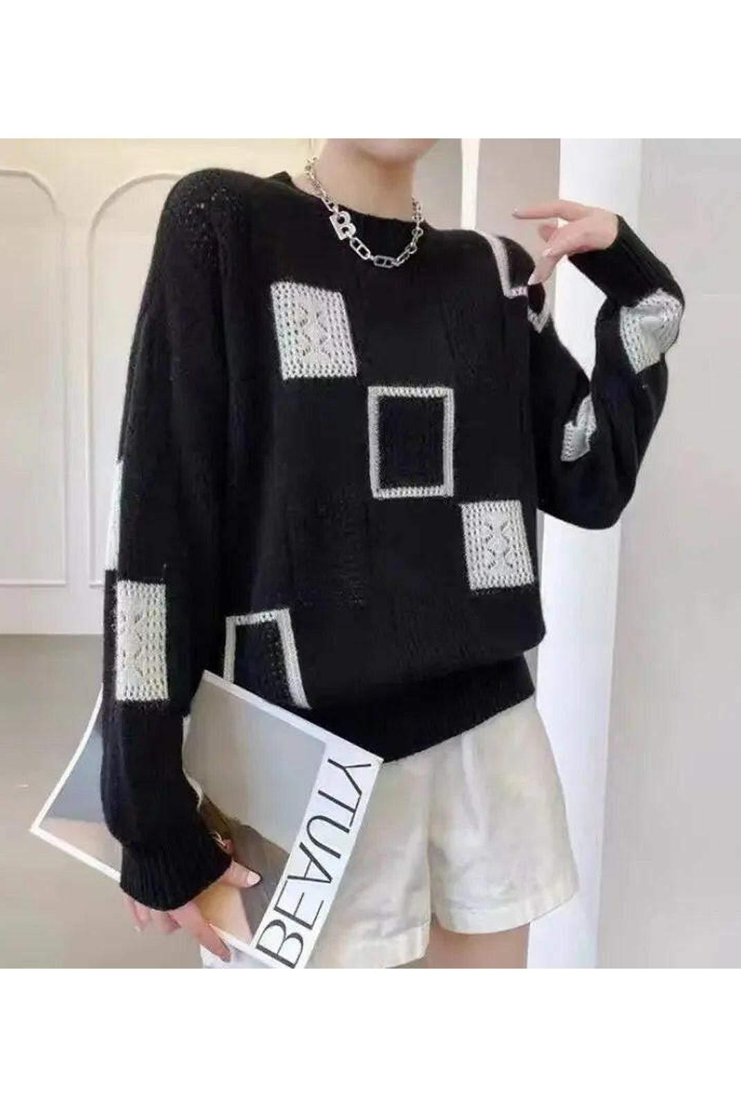 White Lumina Wear Rema Geometric Pullover sweater with a modern geometric pattern, displayed on a mannequin.