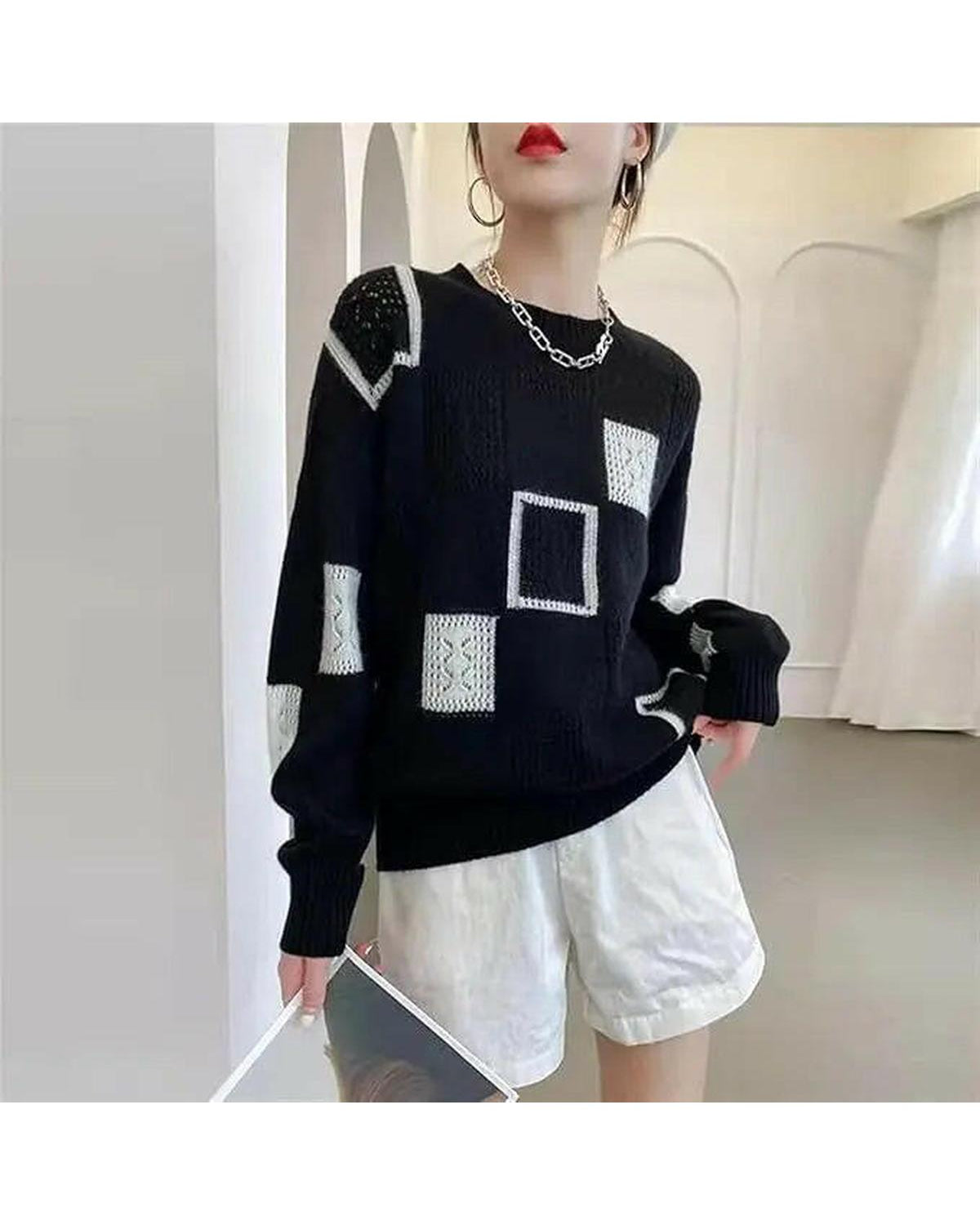 White Lumina Wear Rema Geometric Pullover sweater with bold geometric patterns, displayed flat.
