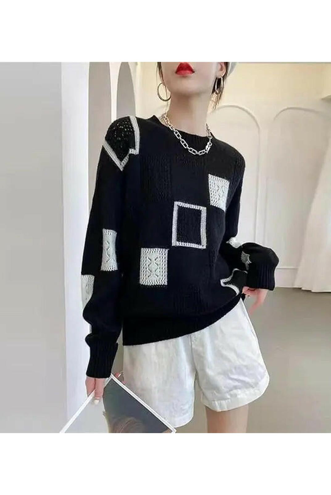White Lumina Wear Rema Geometric Pullover sweater with bold geometric patterns, displayed flat.