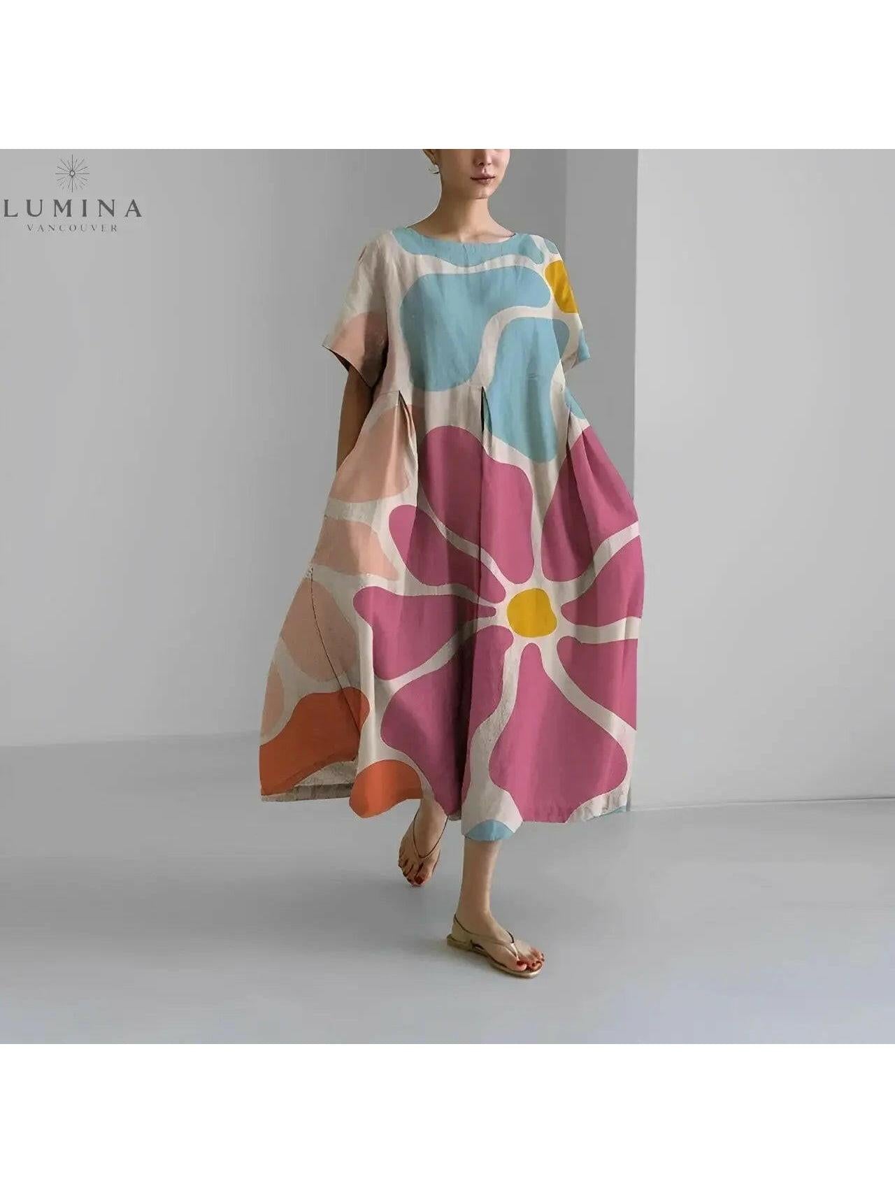 Lumina Vancouver Amelia floral dress with vibrant flower pattern, sleeveless design, and lightweight fabric for a stylish summer look.