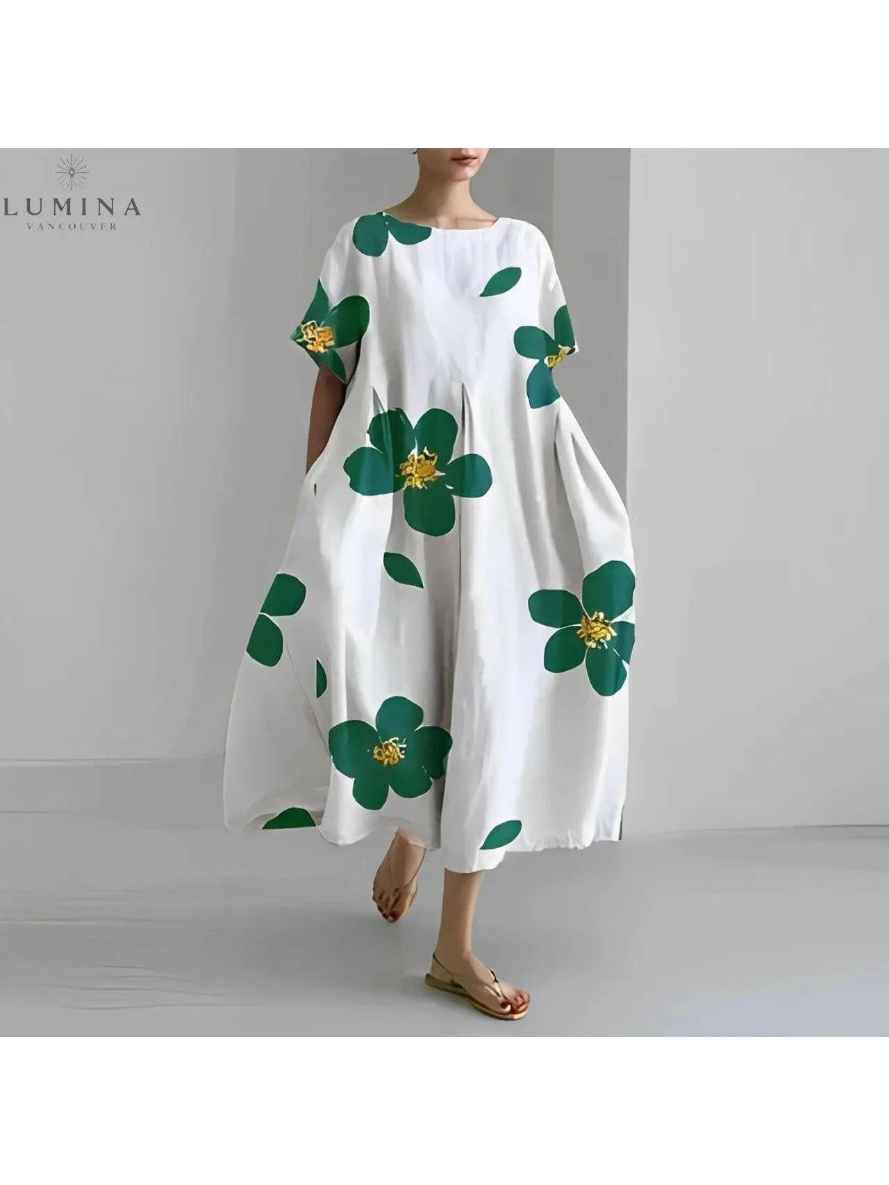 Lumina Vancouver Amelia floral dress featuring a colorful flower pattern and flowing fabric, displayed on a hanger.