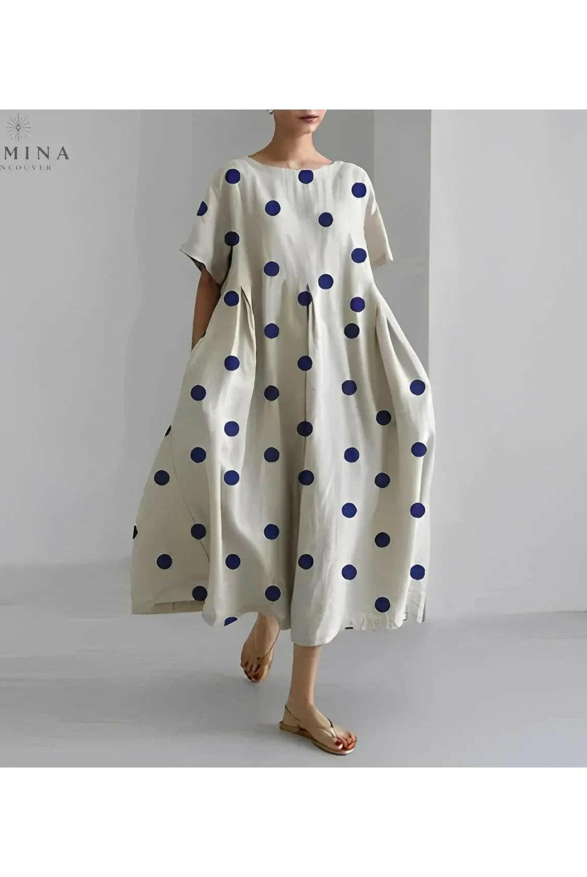 Lumina Wear Amelia floral dress with vibrant flower print, sleeveless design, and lightweight fabric ideal for spring and summer wear.