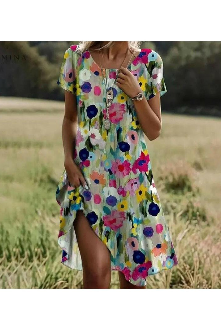 Lumina Wear Callie spring dress with a vibrant floral pattern, lightweight fabric, and a flattering fit perfect for warm weather.