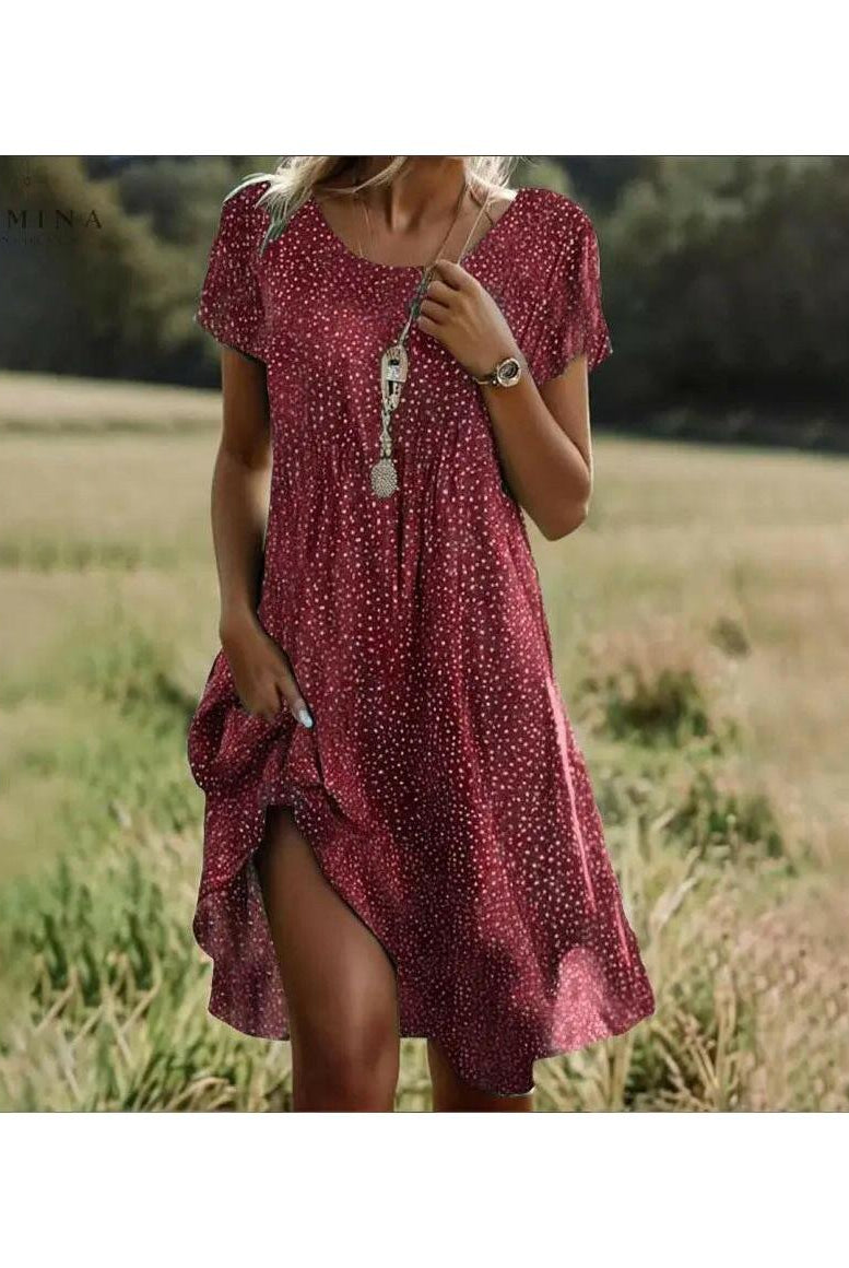 Lumina Wear Callie Spring Dress with floral print, lightweight fabric, and feminine fit, perfect for warm weather occasions.