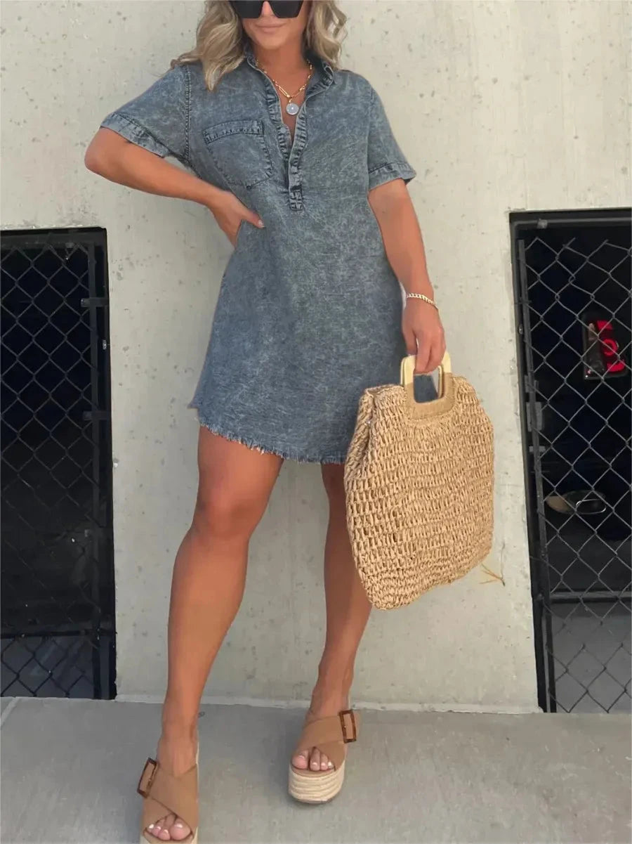 Grey Emberlynette denim shirt dress by Lumina Vancouver, showcasing a casual, button-front design with collar and rolled sleeves.
