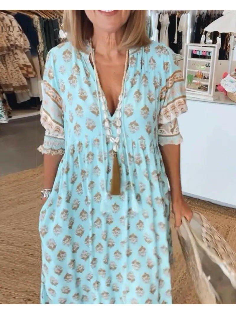 Blue vintage spring dress by Lumina Vancouver featuring a fitted bodice and flowing skirt, perfect for warm-weather wear.