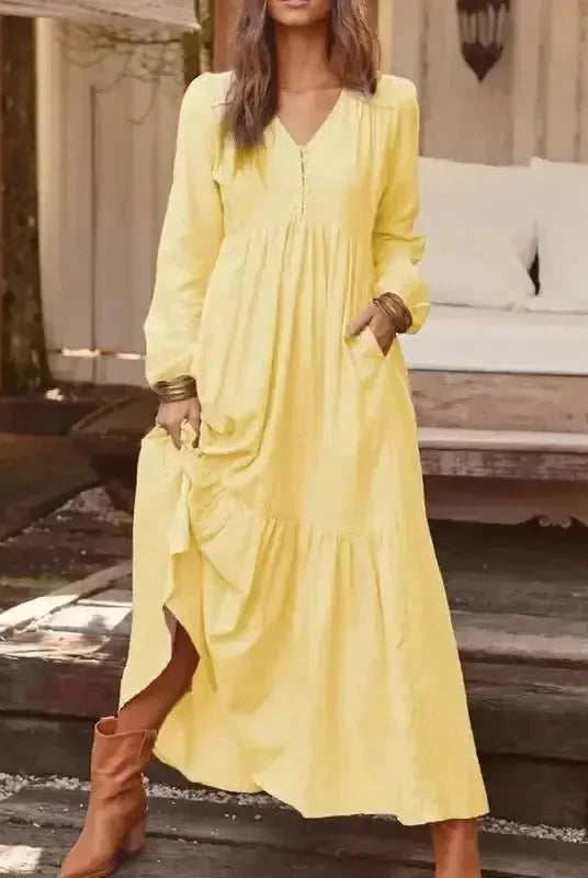 Light yellow Lumina Vancouver Giulia long sleeve dress displayed on a mannequin, featuring a fitted silhouette and elegant design.