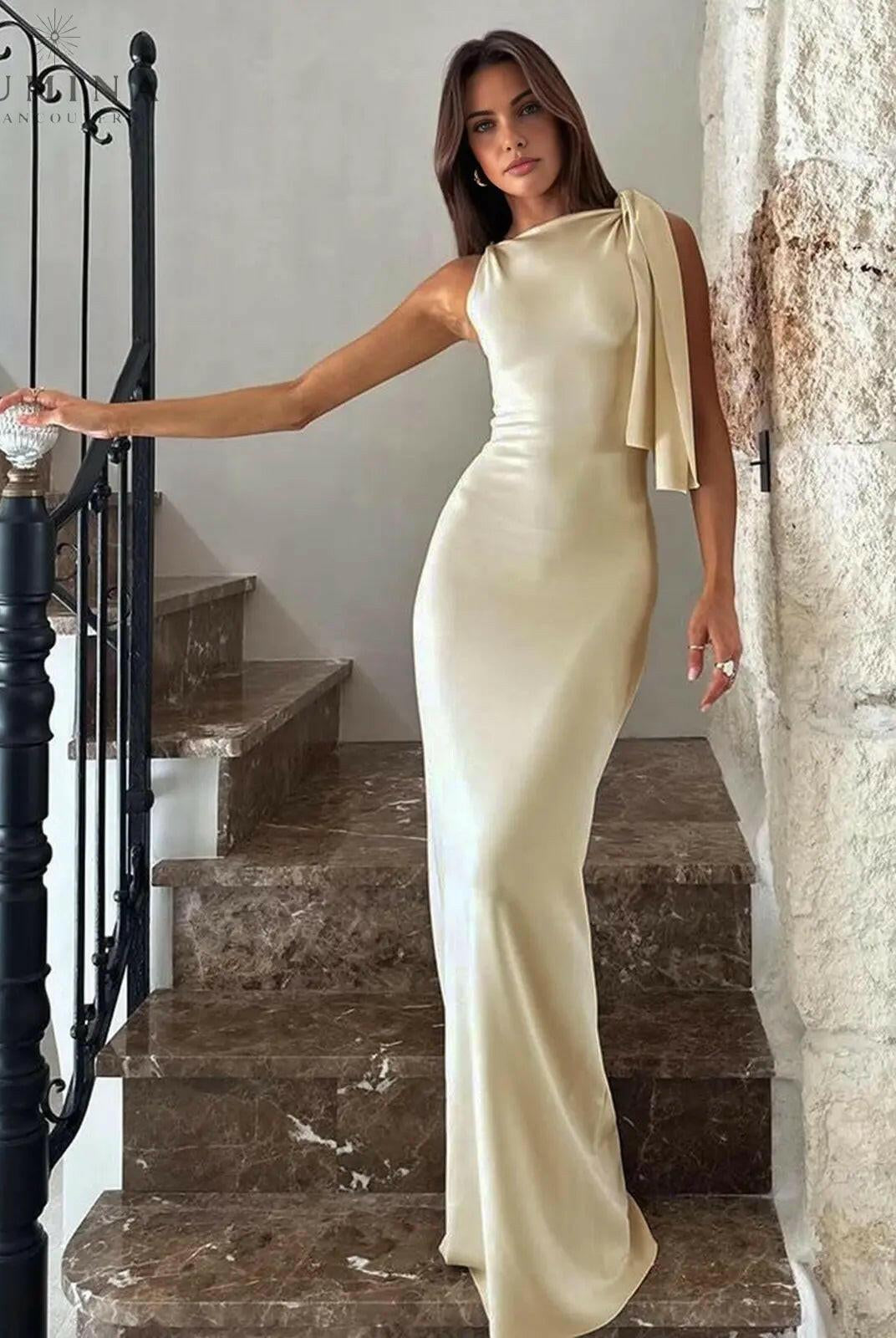 Off-white Yasmine Maxi Dress by Lumina Wear featuring a knotted waist and flowing fabric, perfect for elegant occasions.