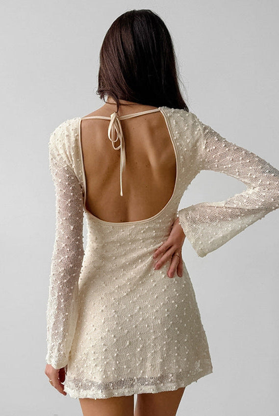 Lumina Wear Wynonna mini dress in apricot Aurora jacquard fabric, featuring textured design and a stylish short silhouette.