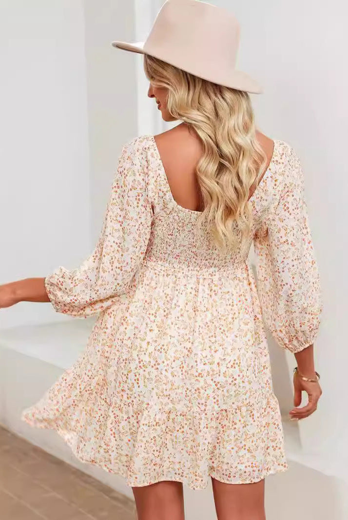 Apricot Valentina Rose Harlow A-Line Mini Dress by Lumina Vancouver, with flowy fabric and feminine silhouette.
