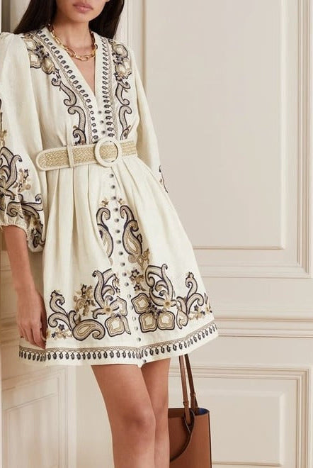 Apricot embroidered boho mini dress by Lumina Vancouver featuring intricate marigold embroidery and a relaxed, stylish fit.