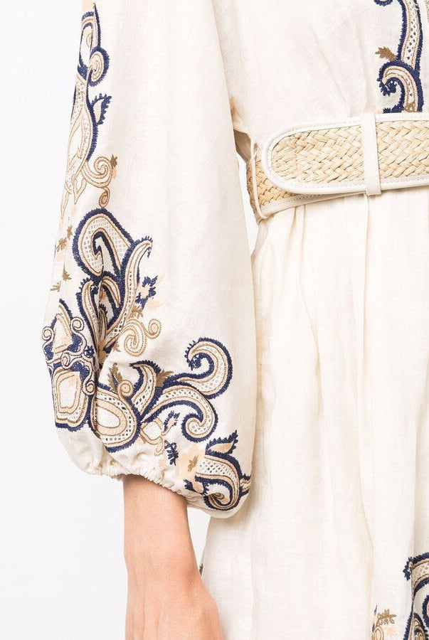 Apricot embroidered boho mini dress by Lumina Vancouver featuring intricate marigold embroidery and flowy, relaxed fit.