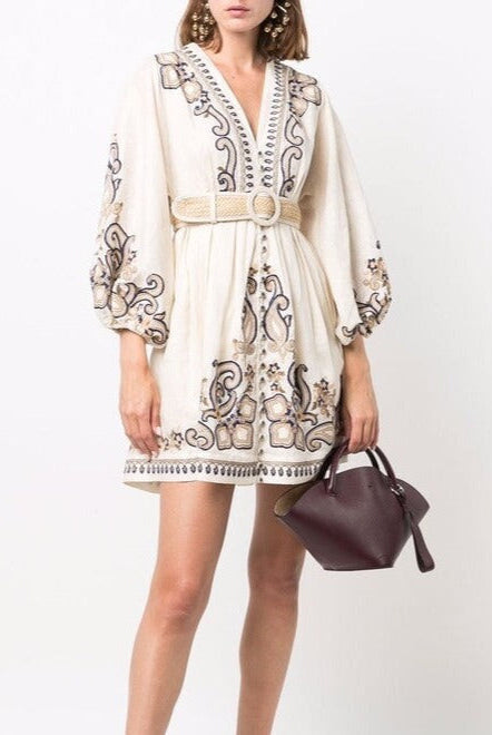 Apricot embroidered boho mini dress by Lumina Vancouver with marigold floral embroidery, lightweight and stylish for casual wear.
