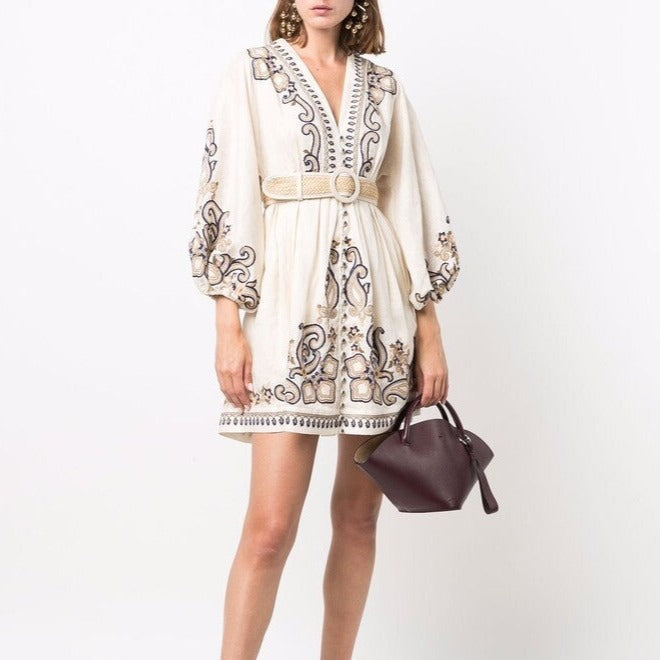 Apricot embroidered boho mini dress by Lumina Vancouver with marigold floral embroidery, lightweight and stylish for casual wear.
