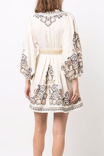 Apricot embroidered boho mini dress by Lumina Vancouver featuring marigold floral embroidery and a relaxed, stylish fit.
