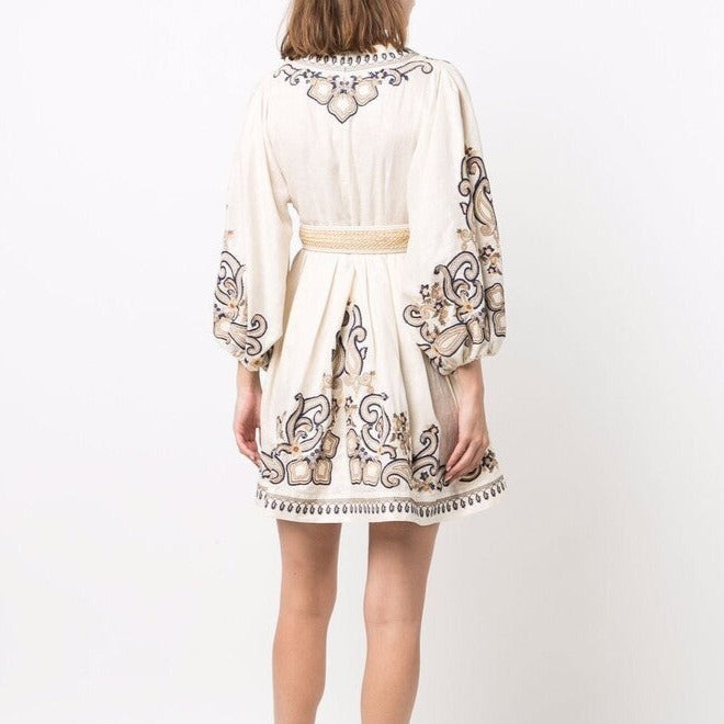 Apricot embroidered boho mini dress by Lumina Vancouver featuring marigold floral embroidery and a relaxed, stylish fit.