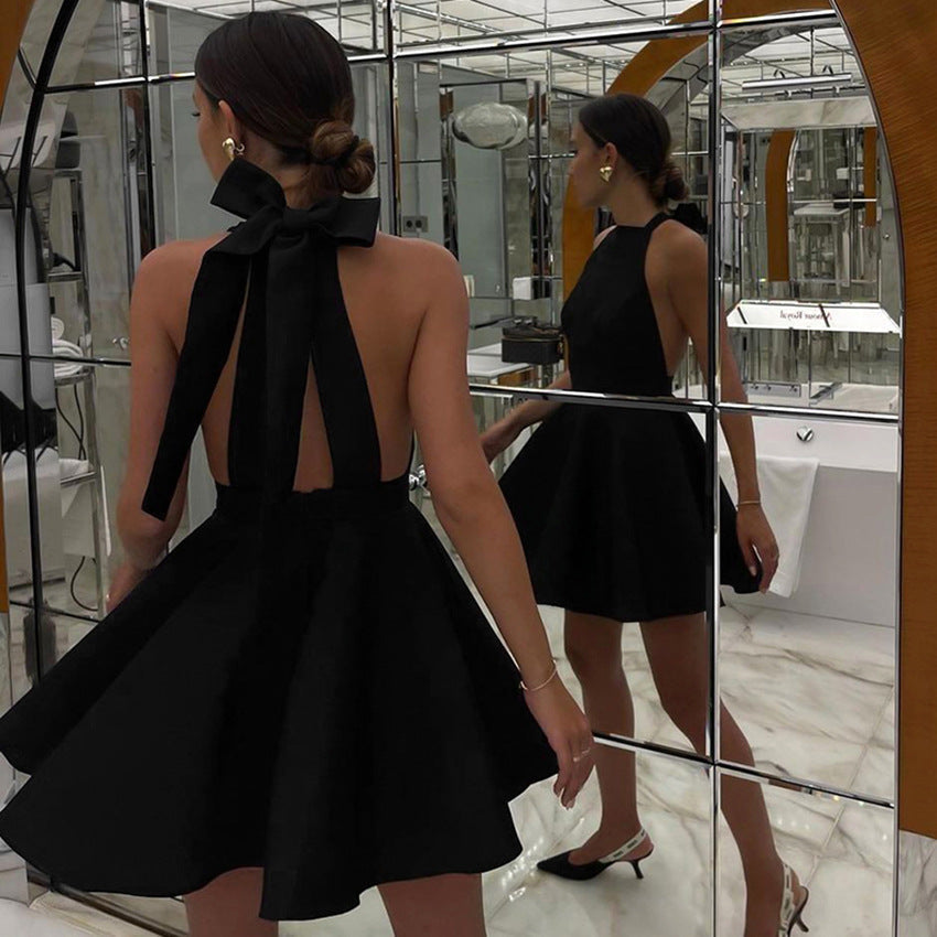 Black Alexandrine halter neck mini dress by Lumina Vancouver, stylish sleeveless dress with a fitted silhouette.