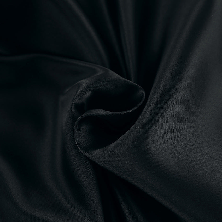 Black Alexandrine halter neck mini dress by Lumina Vancouver, featuring a stylish and elegant design perfect for evening wear.