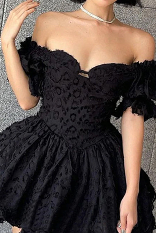 Black off-shoulder mini dress by Lumina Wear, Aino style, featuring a fitted silhouette and stylish neckline.