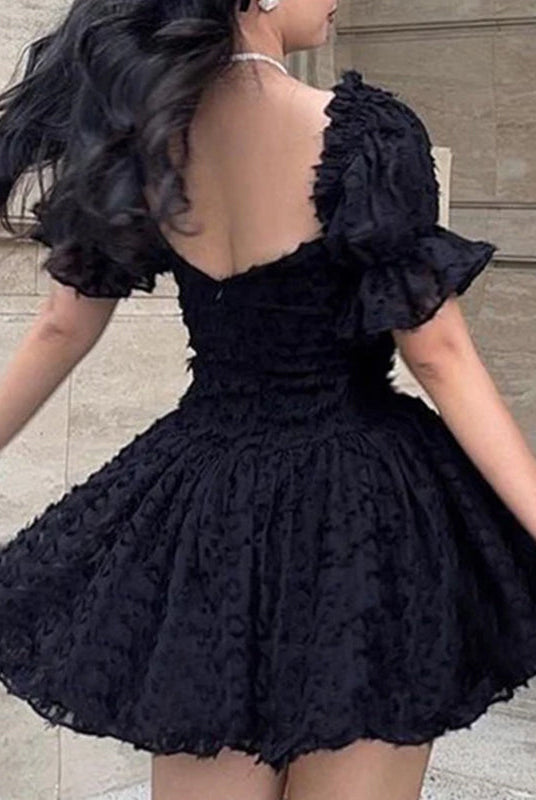 Black off-shoulder mini dress by Lumina Wear, stylish Aino mini dress with a fitted silhouette, perfect for dressy occasions.