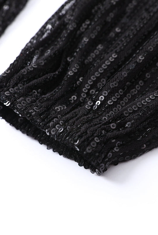 Black Celeste sequin mini dress by Lumina Vancouver featuring a loose fit and stylish design, perfect for evening wear.