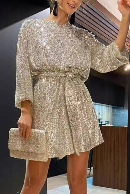 Black Celeste sequin mini dress by Lumina Vancouver, loose fit with shimmering sequins, stylish and elegant for special occasions.