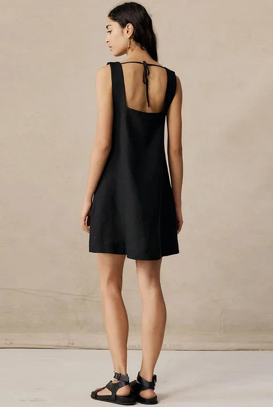 Black Celestina sleeveless mini dress by Lumina Wear, featuring a fitted silhouette and stylish design from Lumina Vancouver.
