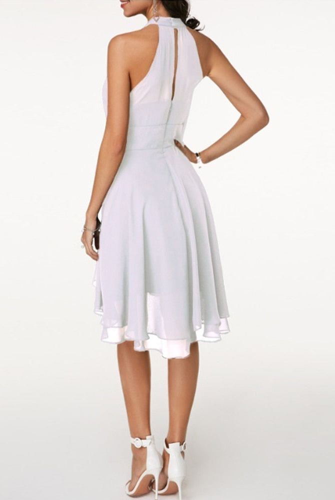 Black Lyra halter neck mini dress with layered skirt from Lumina Vancouver, styled for a chic, modern look.
