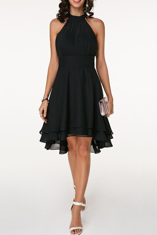 Black Lyra halter neck mini dress with layered skirt by Lumina Vancouver, featuring a fitted top and flowing layered skirt.