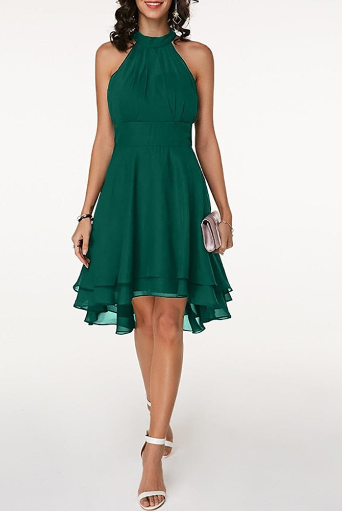 Black Lyra halter neck mini dress with layered skirt from Lumina Vancouver, shown on a model.
