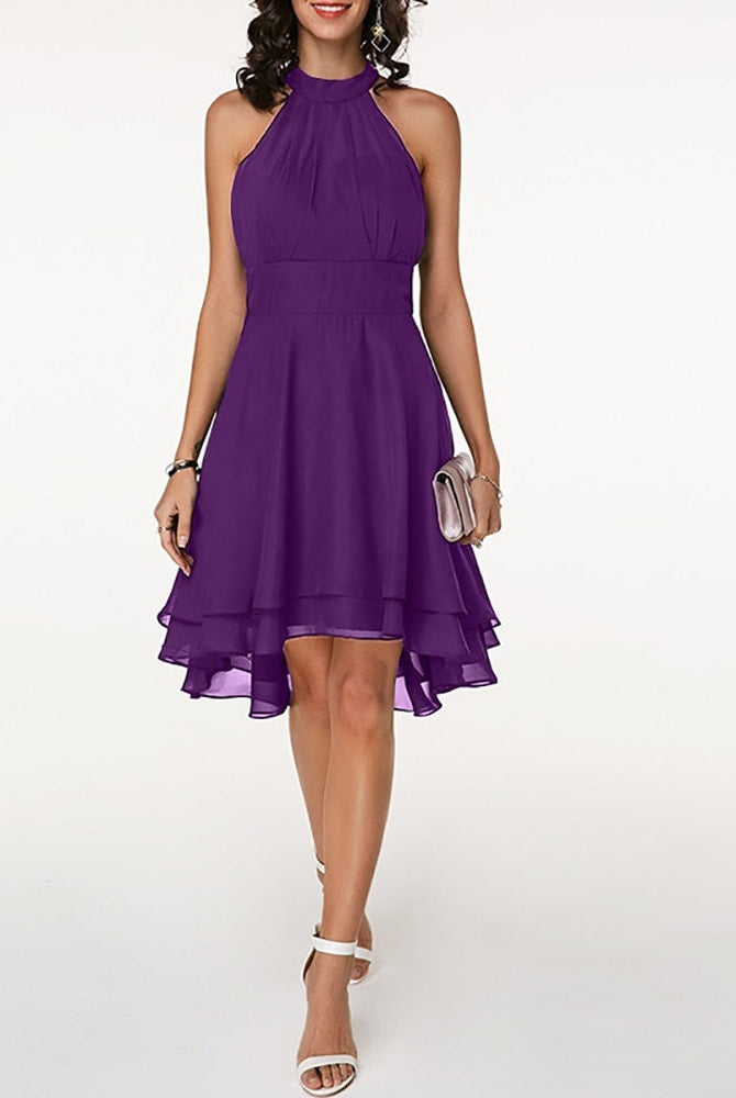 Black Lyra halter neck mini dress with layered skirt by Lumina Vancouver, shown on a model.