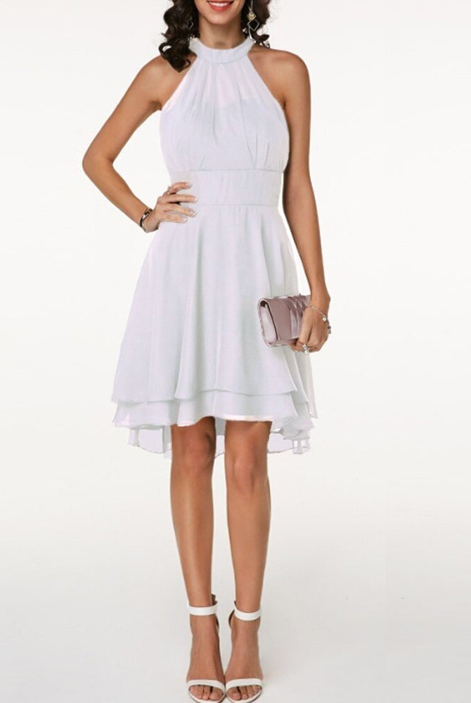 Black Lyra halter neck mini dress with layered skirt from Lumina Vancouver, shown on a model.