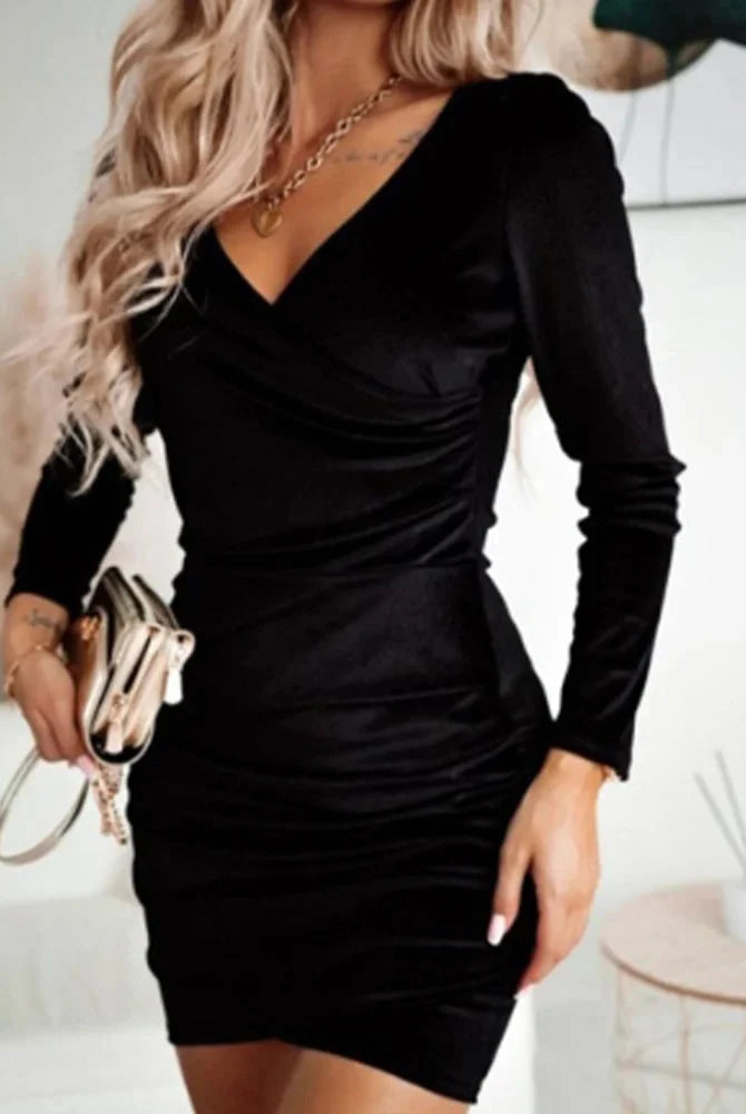 Black Nia wrap mini dress with V-neck and long sleeves by Lumina Vancouver, featuring a fitted silhouette and elegant design.